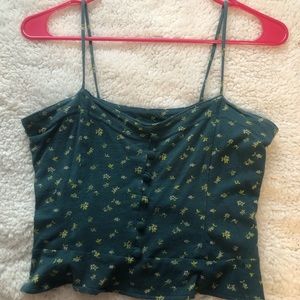Small tank top with flowers on it and felt buttons